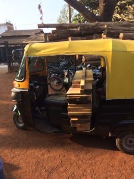 Indian rickshaw with lumber