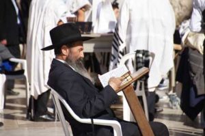 jewish man reading masoretic text with annotations